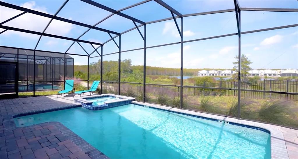 2940 Simile Street Kissimmee, FL 34746 - Photo 15 of 51 a view of a lake from a porch