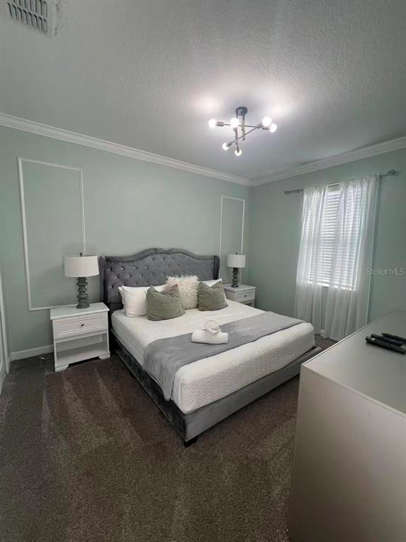 2940 Simile Street Kissimmee, FL 34746 - Photo 31 of 51 a spacious bedroom with a bed and a window