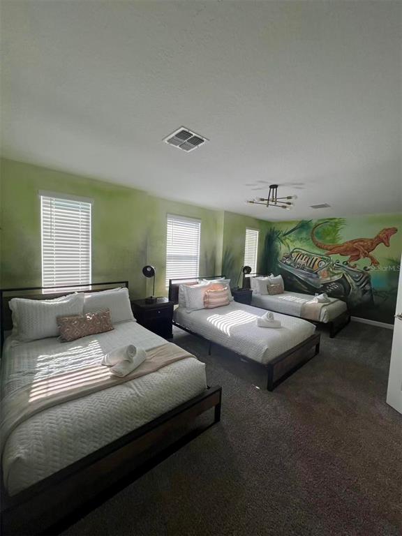 2940 Simile Street Kissimmee, FL 34746 - Photo 37 of 51 a bedroom with bed and a window