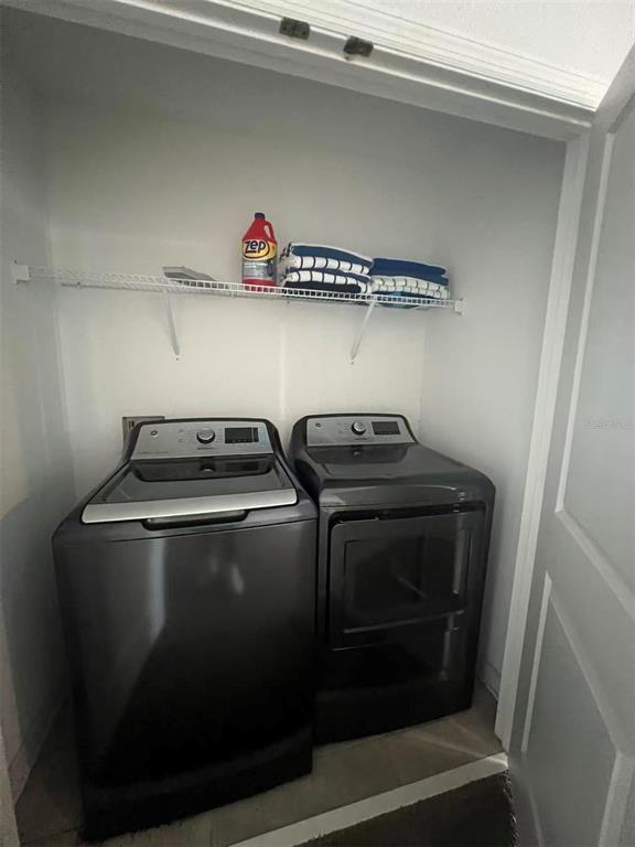 2940 Simile Street Kissimmee, FL 34746 - Photo 42 of 51 a utility room with dryer and washer
