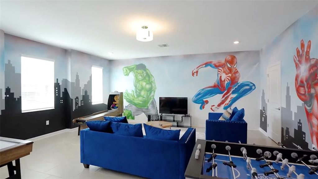 2940 Simile Street Kissimmee, FL 34746 - Photo 7 of 51 a living room with furniture and a flat screen tv