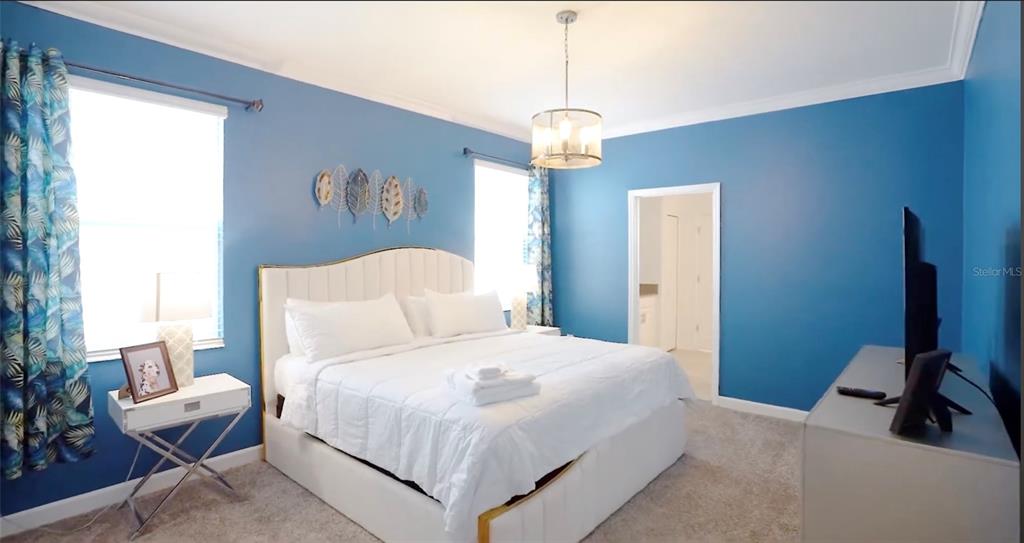 2940 Simile Street Kissimmee, FL 34746 - Photo 10 of 51 a bedroom with bed and window