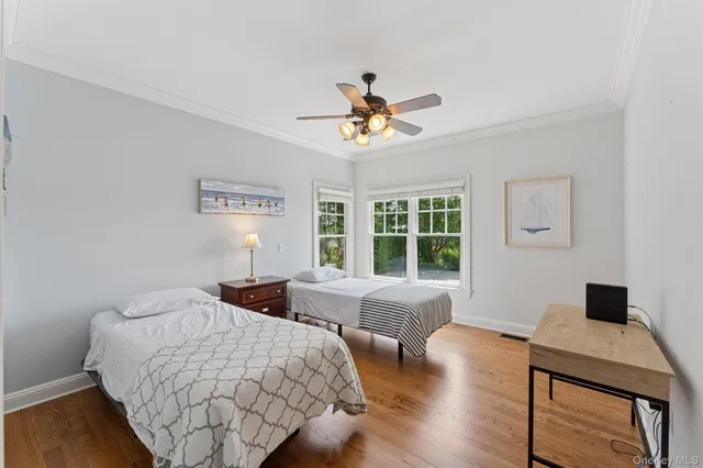 a bedroom with double bed and a window