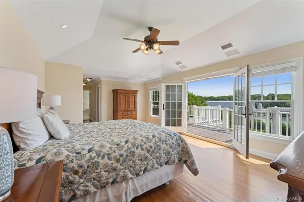 a bedroom with a large bed and a large window