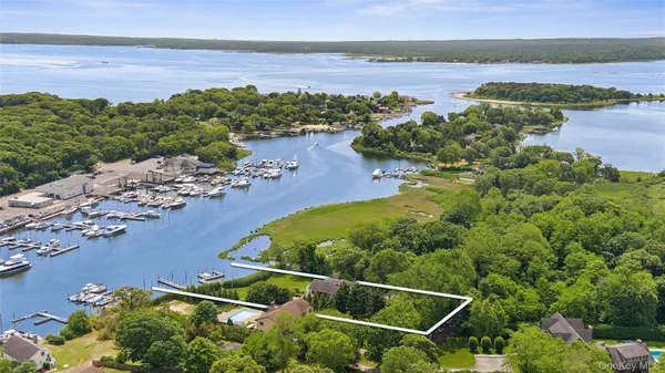 an aerial view of lake residential house and outdoor space