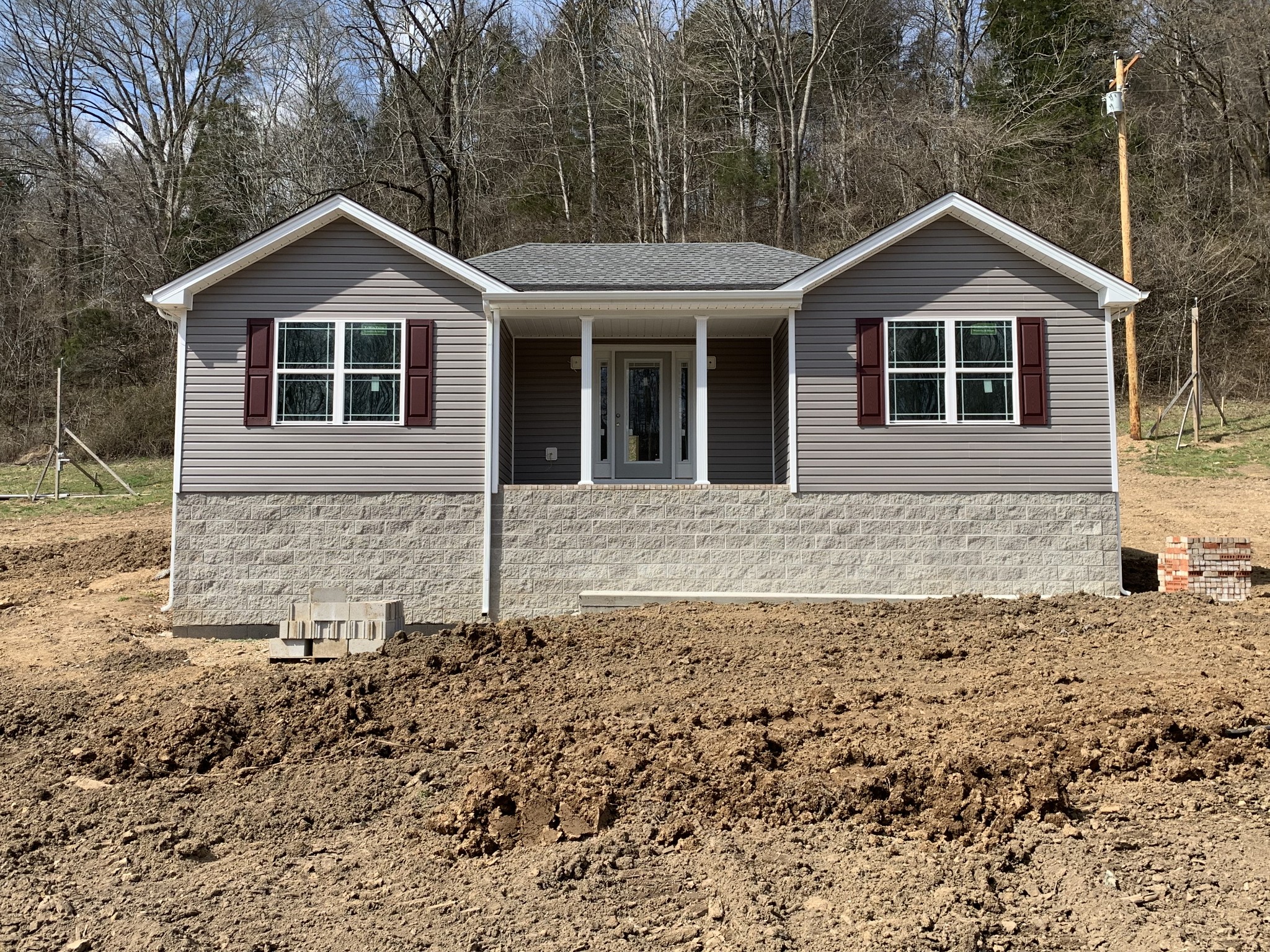 388 Leo Whitley Road Lafayette, TN 37083 - Photo 2 of 10 a front view of a house with a yard
