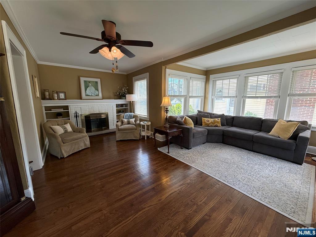 354 Demarest Avenue Oradell, NJ 07649 - Photo 5 of 33 a living room with furniture flat screen tv and a fireplace