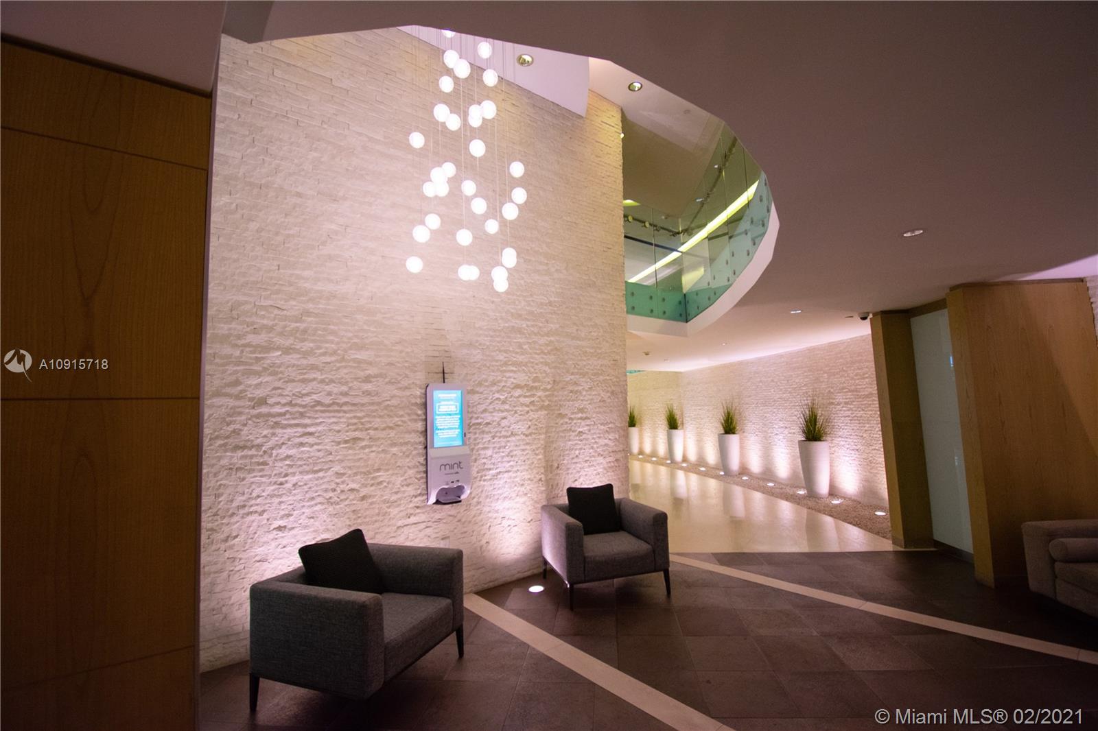 92 Southwest 3rd Street, Unit 2307 Miami, FL 33130 - Photo 15 of 18 a lobby with furniture and a potted plant