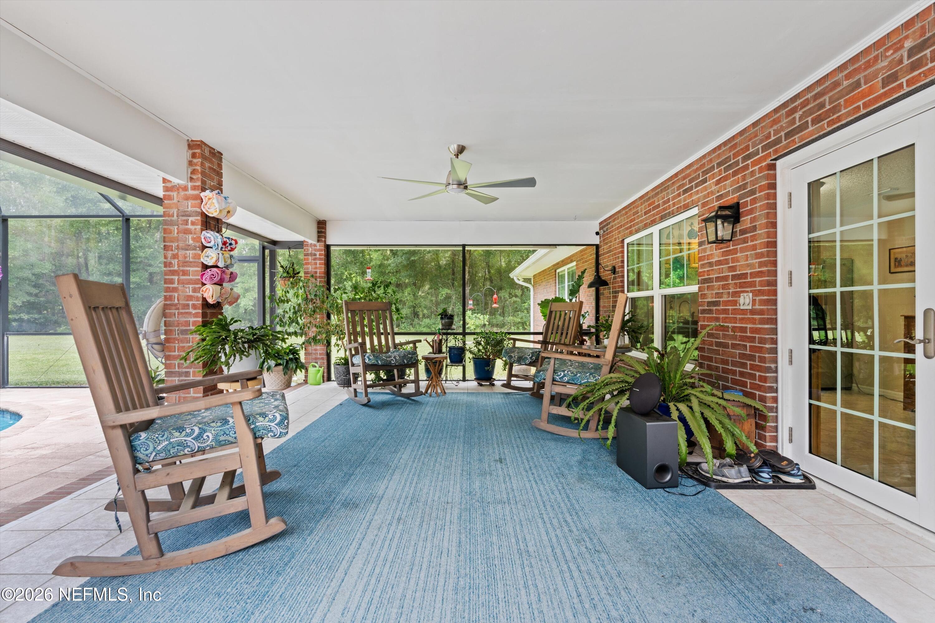 5566 Don Manuel Road Elkton, FL 32033 - Photo 33 of 47 a living room with furniture and a potted plant