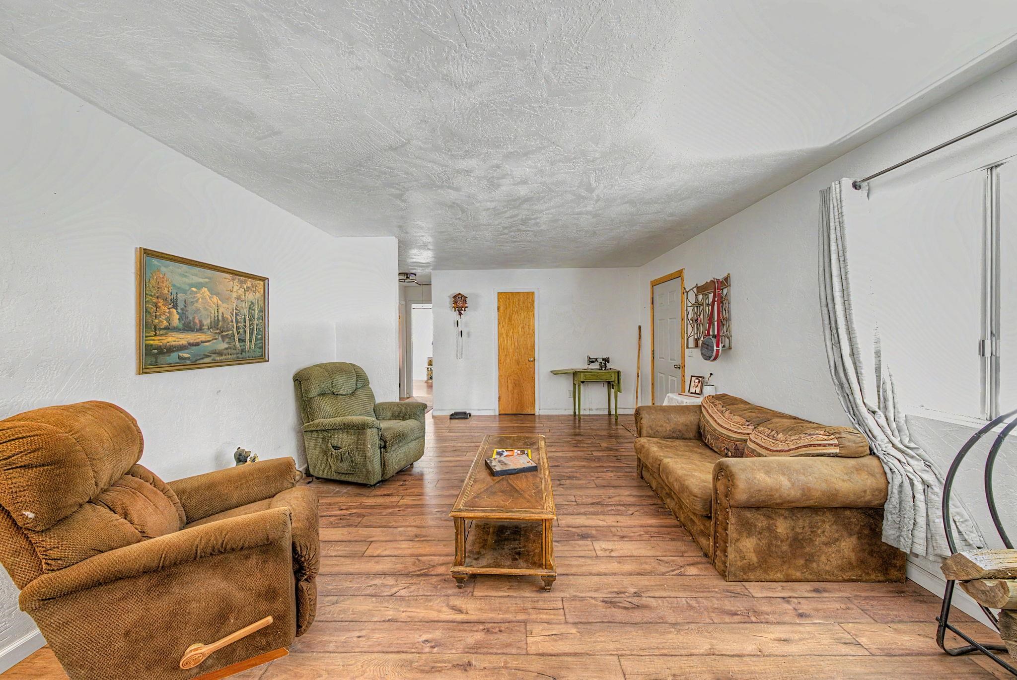 58374 Gill Ranch Road Cromberg, CA 96103 - Photo 39 of 44 a living room with furniture and a wooden floor