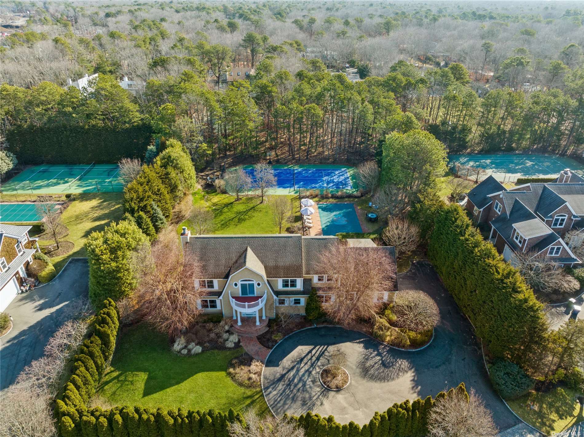 29 Post Fields Lane Quogue, NY 11959 - Photo 1 of 1 an aerial view of a house with a garden and lots of trees