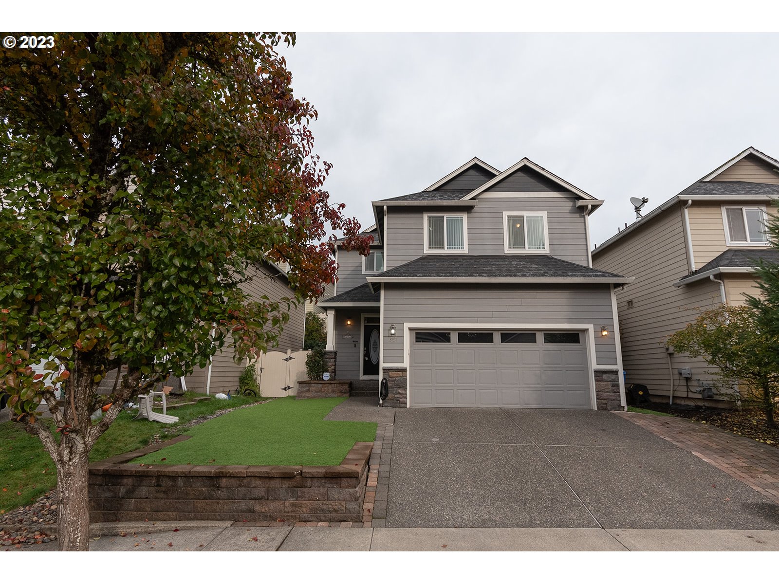 3148 South 3rd Way Ridgefield, WA 98642 - Photo 1 of 27 a front view of a house with a yard and garage