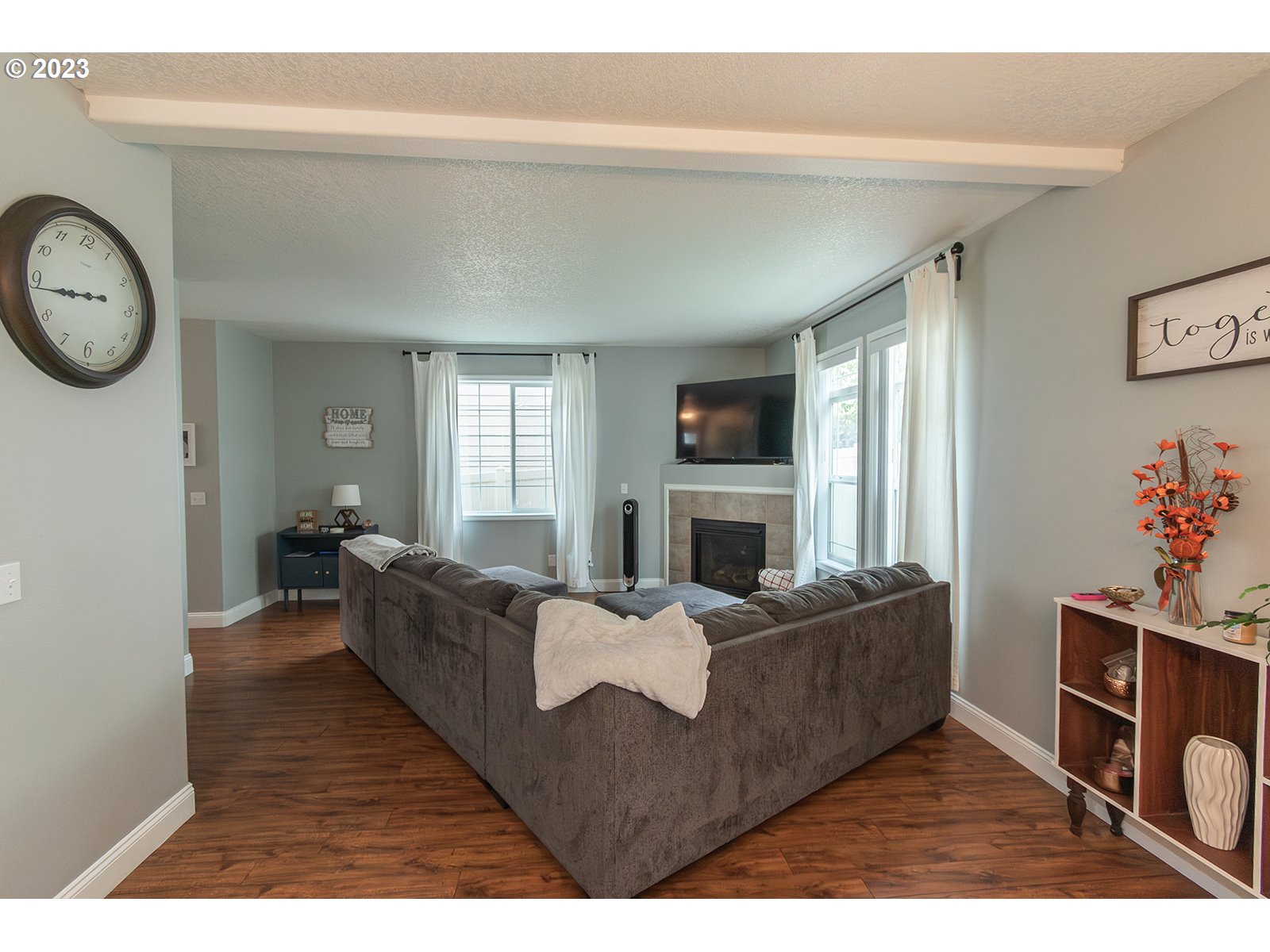 3148 South 3rd Way Ridgefield, WA 98642 - Photo 2 of 27 a living room with furniture a fireplace and a window
