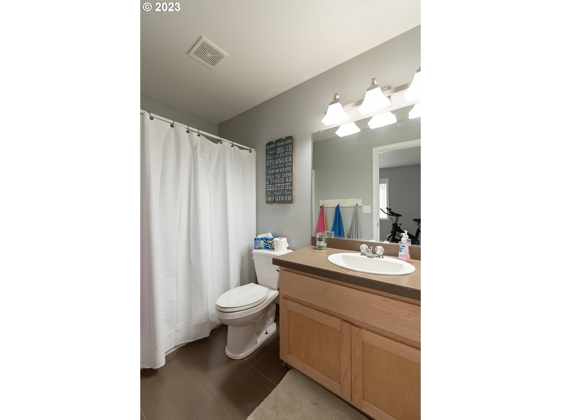 3148 South 3rd Way Ridgefield, WA 98642 - Photo 21 of 27 a bathroom with a toilet a sink and a mirror