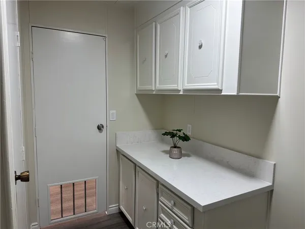 a bathroom with a sink and cabinets