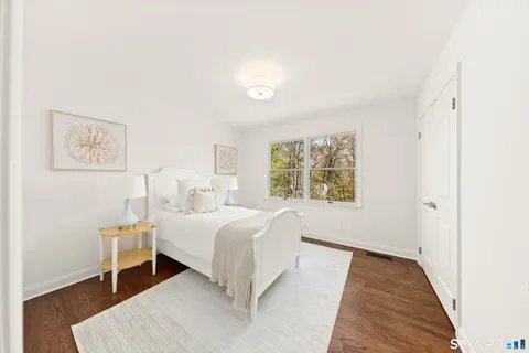 a bed room with a bed and a window