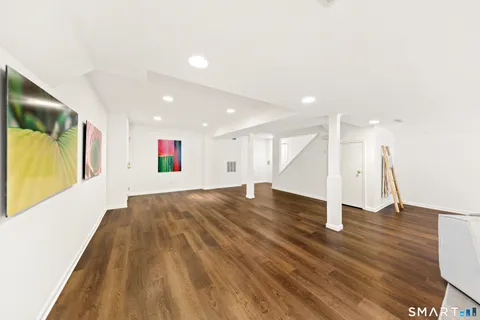a view of an entryway with wooden floor