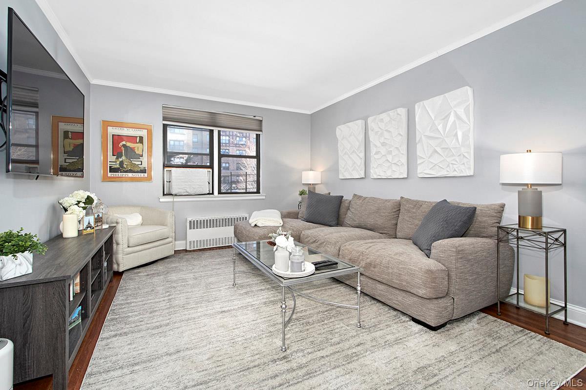 a living room with furniture and a large window
