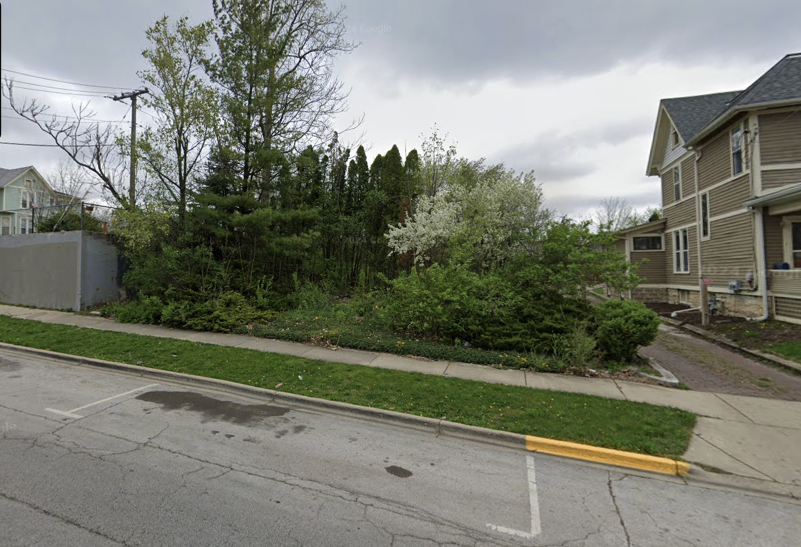 a view of a street with a building in the background