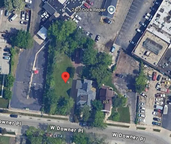 an aerial view of multi story residential building with outdoor space