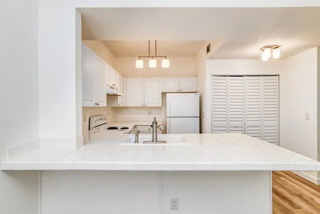 a bathroom with a sink a toilet and a bathtub