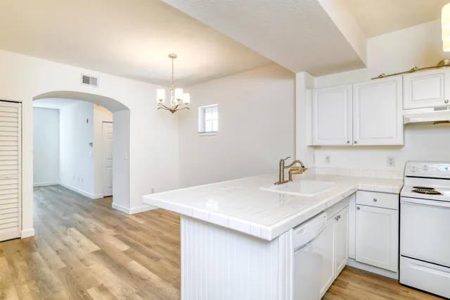 a view of a wrought iron fences in front of house