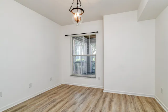 a view of a house with backyard sitting area and garden