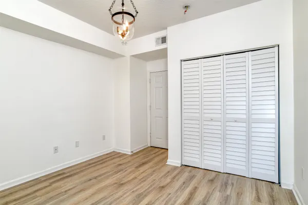 a view of a house with backyard porch and sitting area