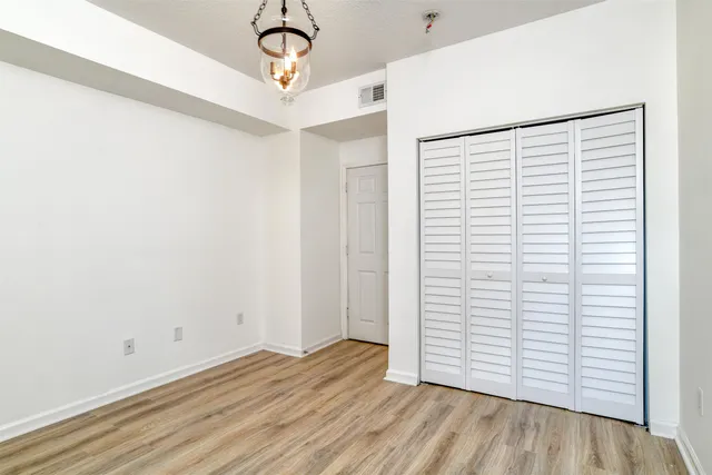 a view of a house with backyard porch and sitting area