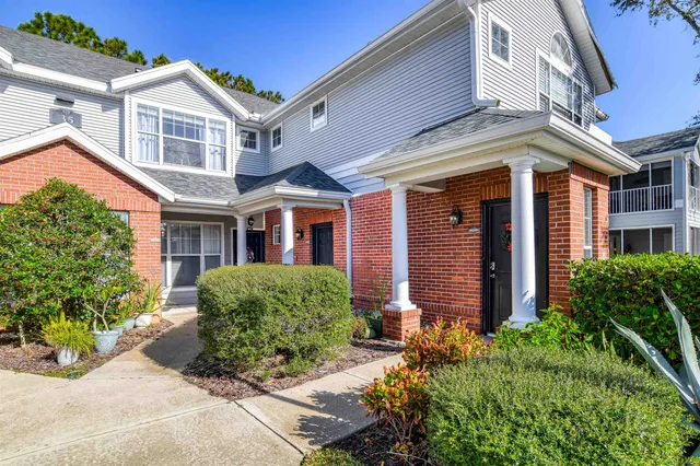 a front view of a building with garden