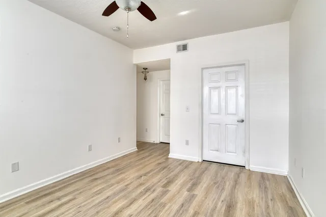 a view of building with river in front of it