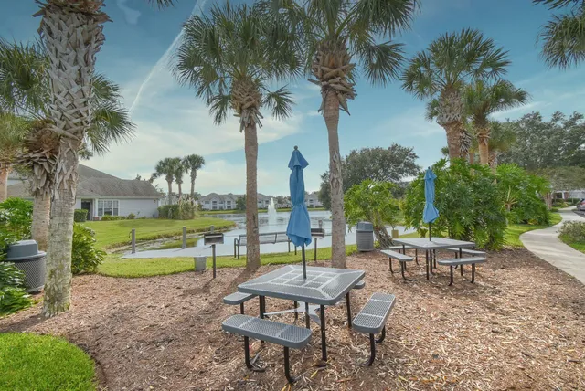 a living room with furniture and a book shelf