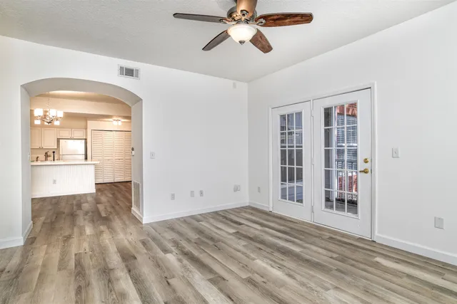 a view of a chair and tables in the balcony