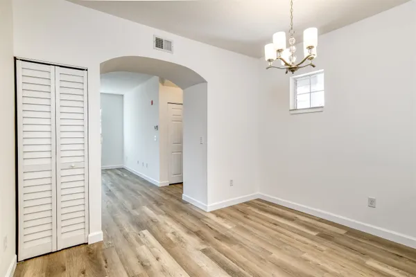a kitchen with kitchen island a sink stainless steel appliances and cabinets