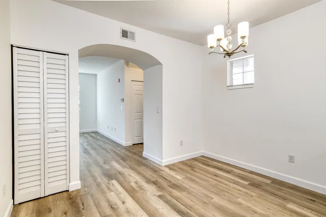 a kitchen with kitchen island a sink stainless steel appliances and cabinets