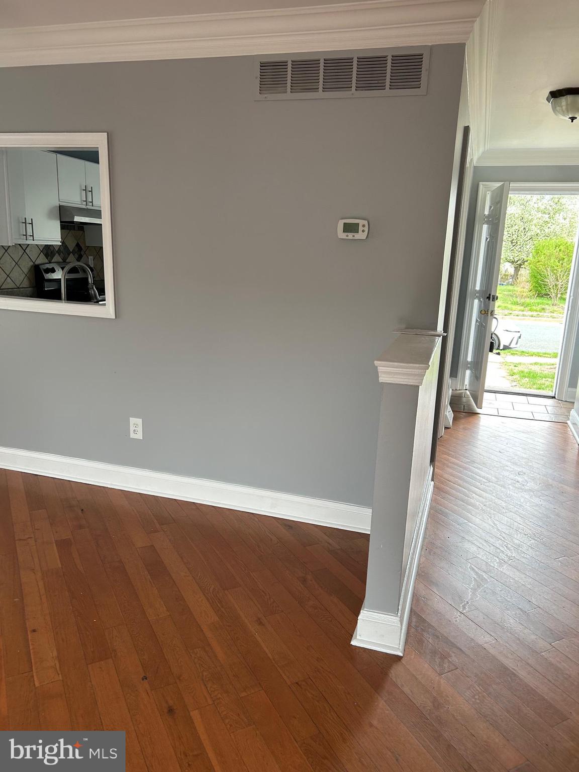 332 Cold Spring Place Dover, DE 19904 - Photo 4 of 10 a view of a hallway with wooden floor and staircase