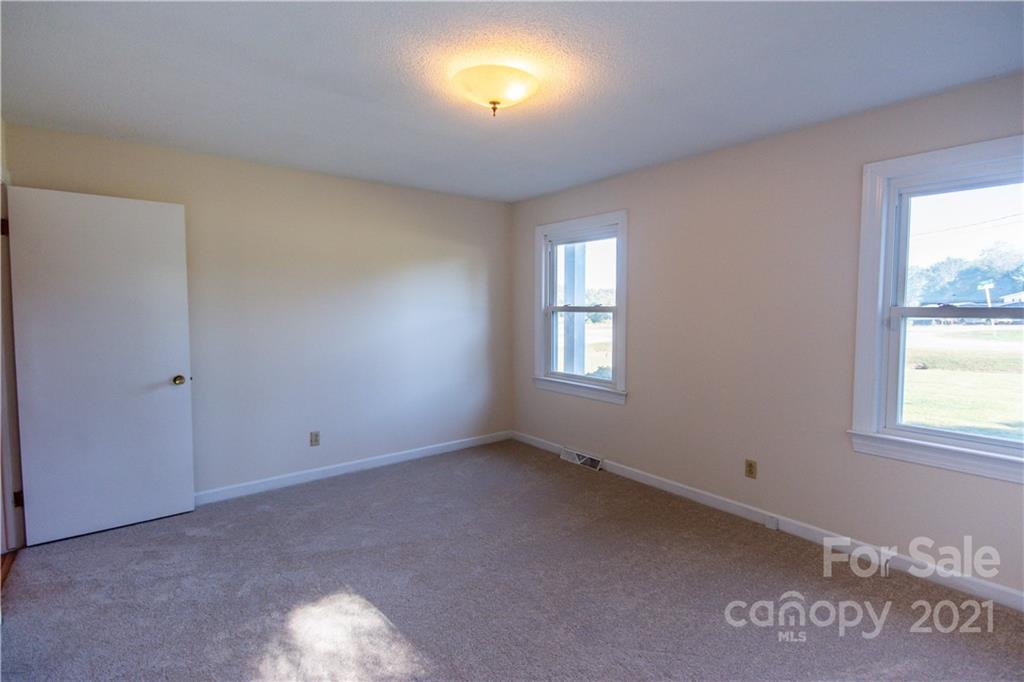 149 Walk On Road Stony Point, NC 28678 - Photo 22 of 45 an empty room with windows