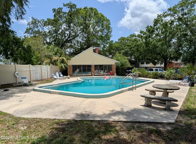 a view of a backyard of the house