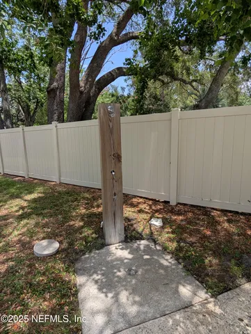 a view of a yard with a tree