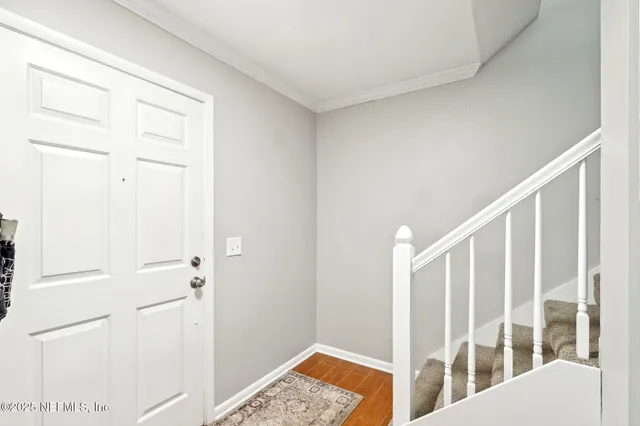 a view of entryway with wooden floor