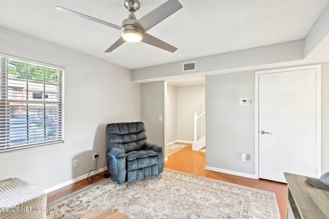 a living room with furniture and a window