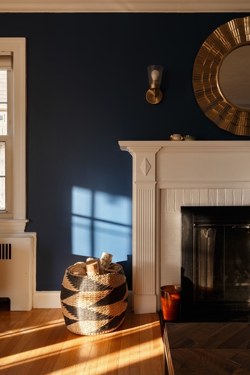 23 Regina Road Newton, MA 02466 - Photo 15 of 33 a living room with furniture and a fireplace