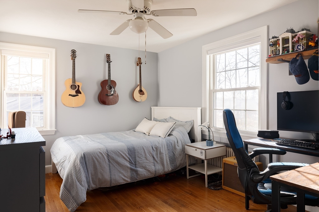 23 Regina Road Newton, MA 02466 - Photo 23 of 33 a bedroom with a bed and a flat screen tv