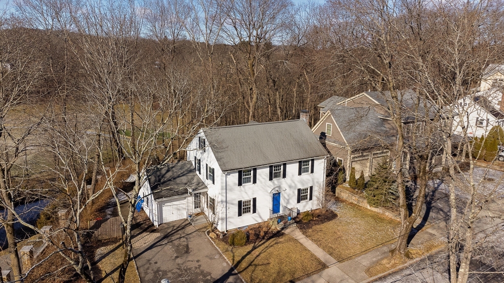 23 Regina Road Newton, MA 02466 - Photo 28 of 33 an aerial view of a house with yard table and chairs