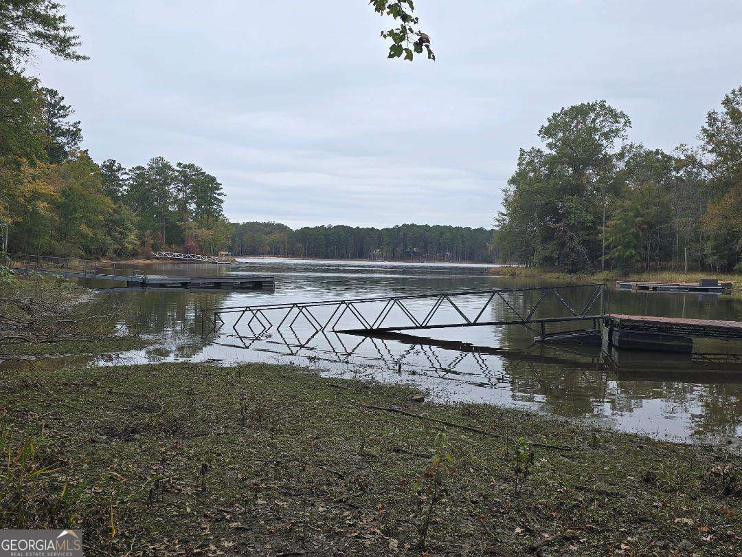 1114 Sunset Cove Tignall, GA 30668 - Photo 1 of 1 a view of a lake with a mountain in the background