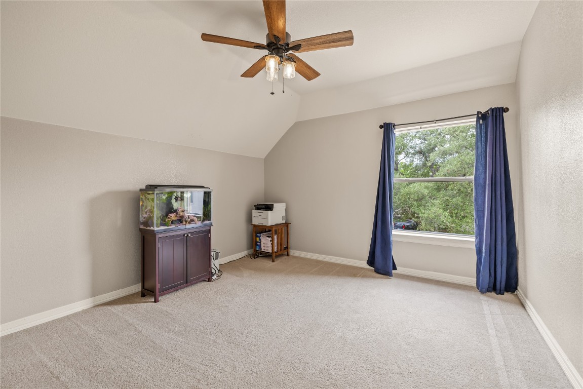 100 South Ridge Circle Georgetown, TX 78628 - Photo 28 of 37 Bonus room with a closet, ceiling fan, light carpet, baseboards, and lofted ceiling