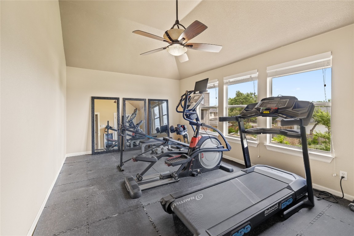 100 South Ridge Circle Georgetown, TX 78628 - Photo 31 of 37 Workout area with baseboards, a closet, and ceiling fan