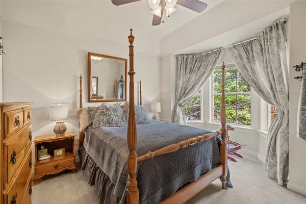 a bathroom with a sink a mirror and a shower