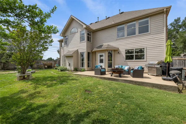 a front view of house with yard and outdoor seating