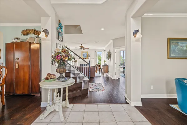 a living room with furniture large window and a fireplace